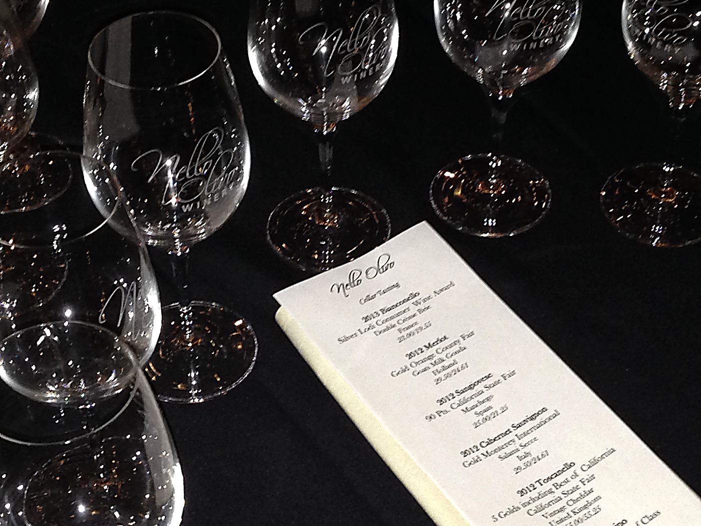 The cellar tasting menu and etched glasses, set for the evening