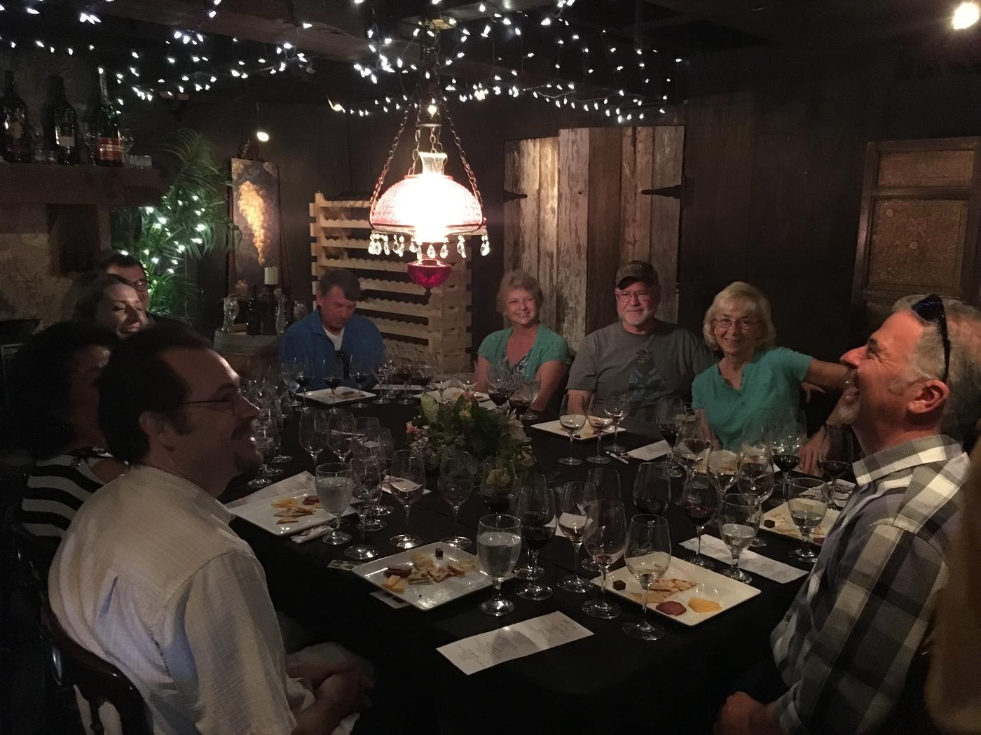 Members around the long cellar table