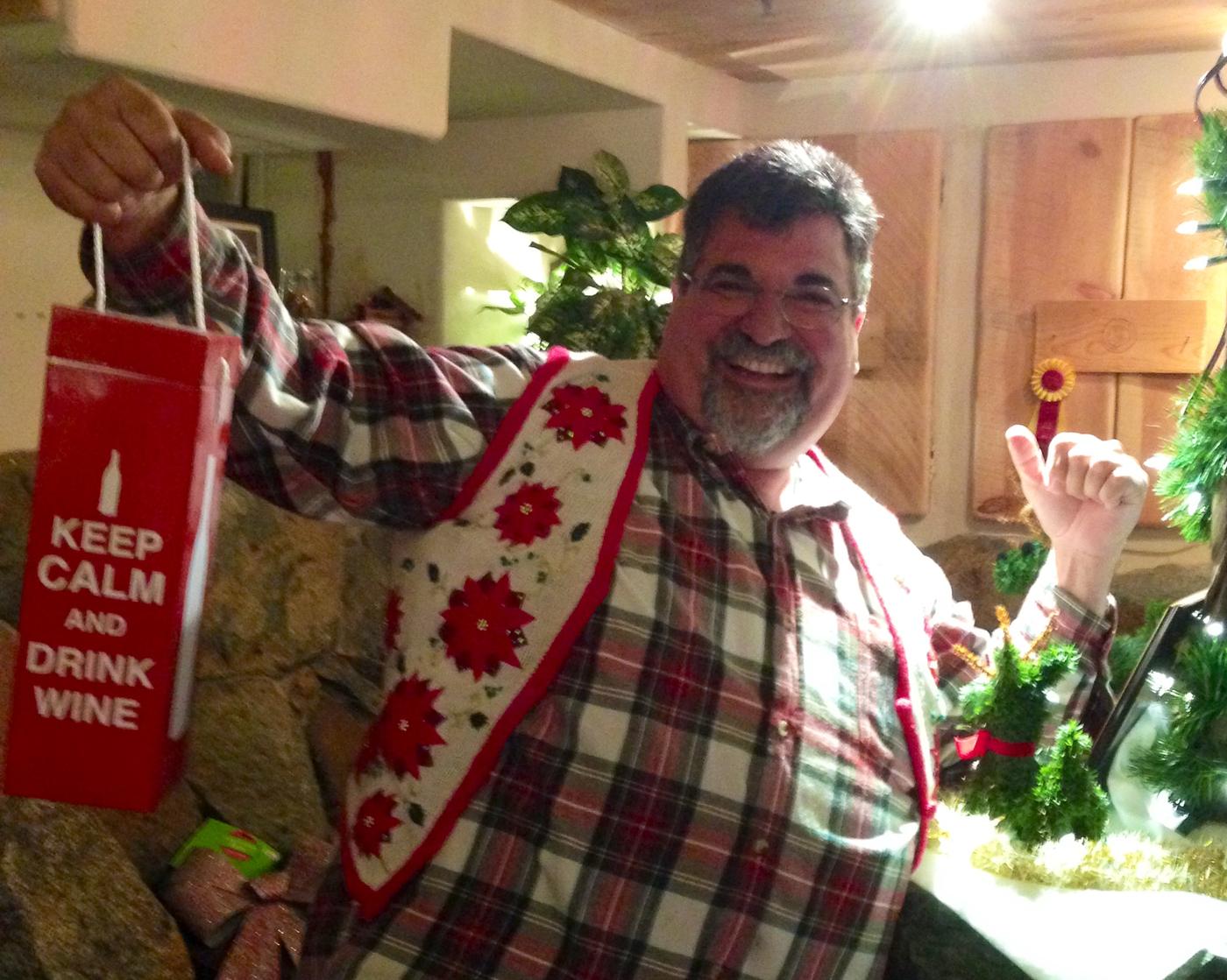 A member holding up his Keep Calm and Drink Wine bag