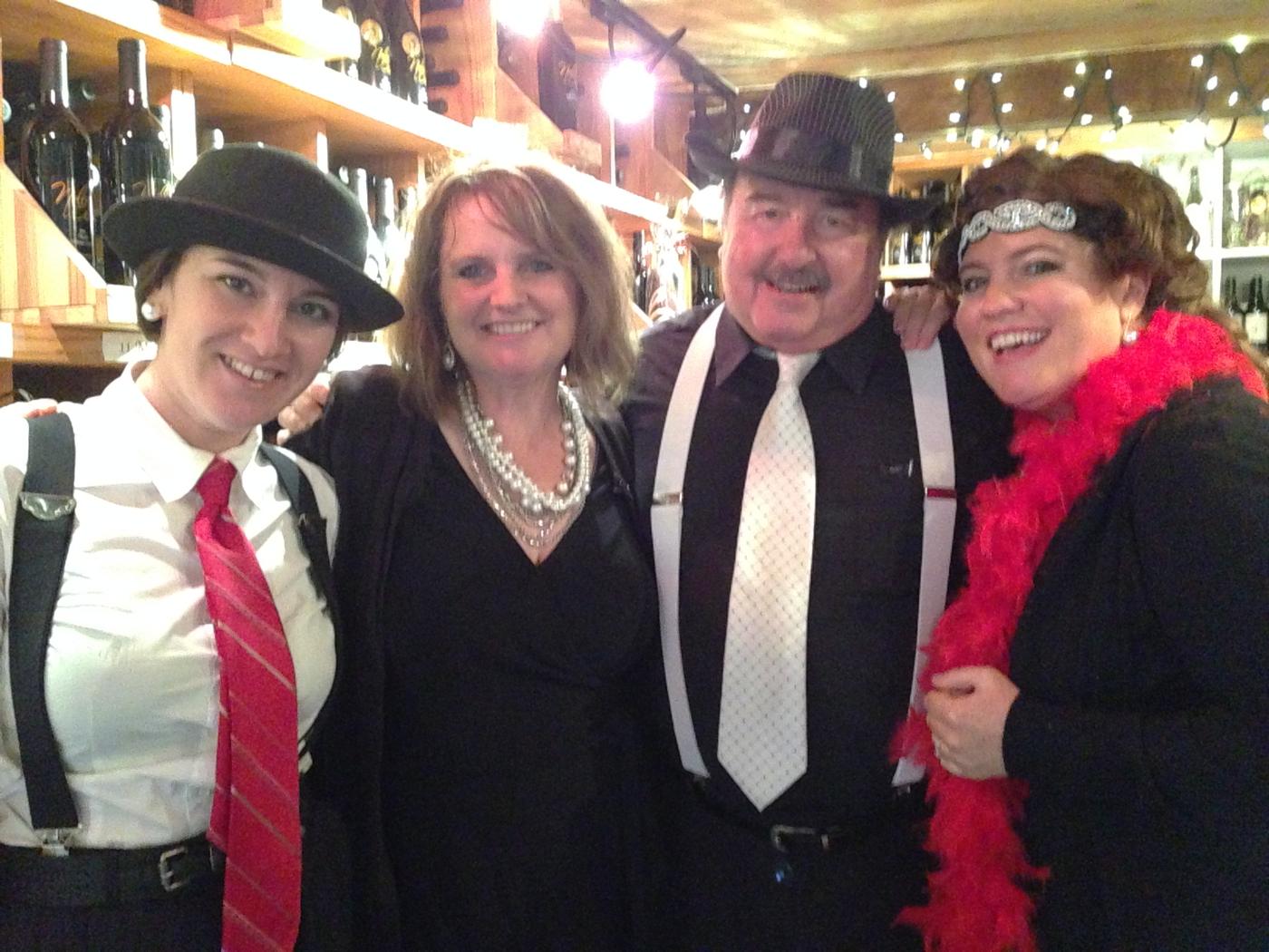 Members in mob pinstripes and a feather boa