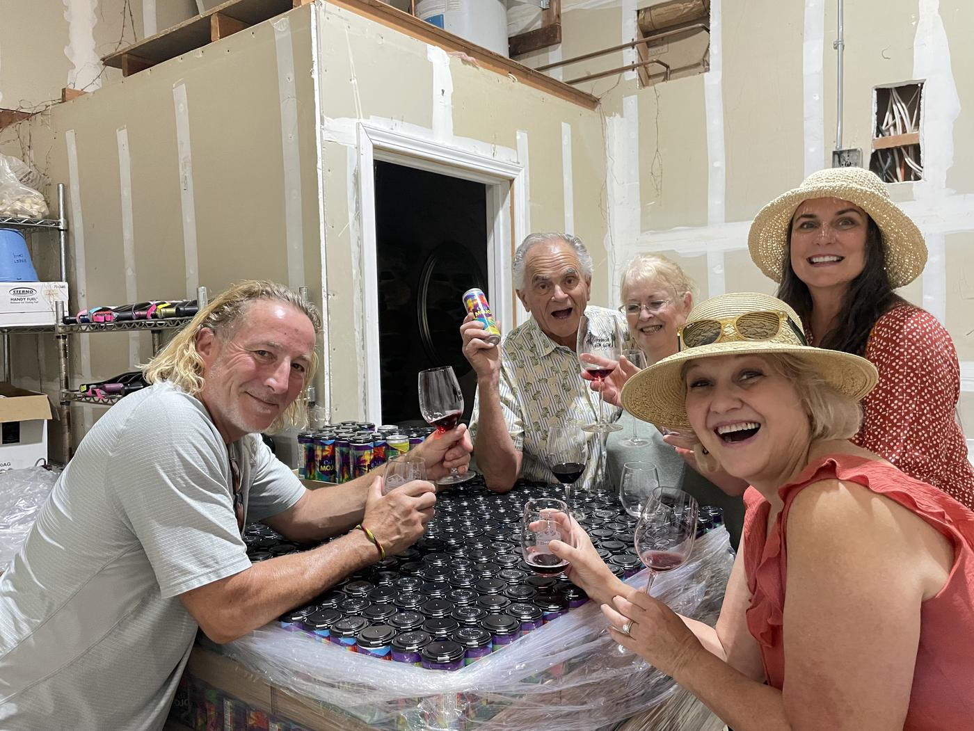 Members bottling with glasses raised