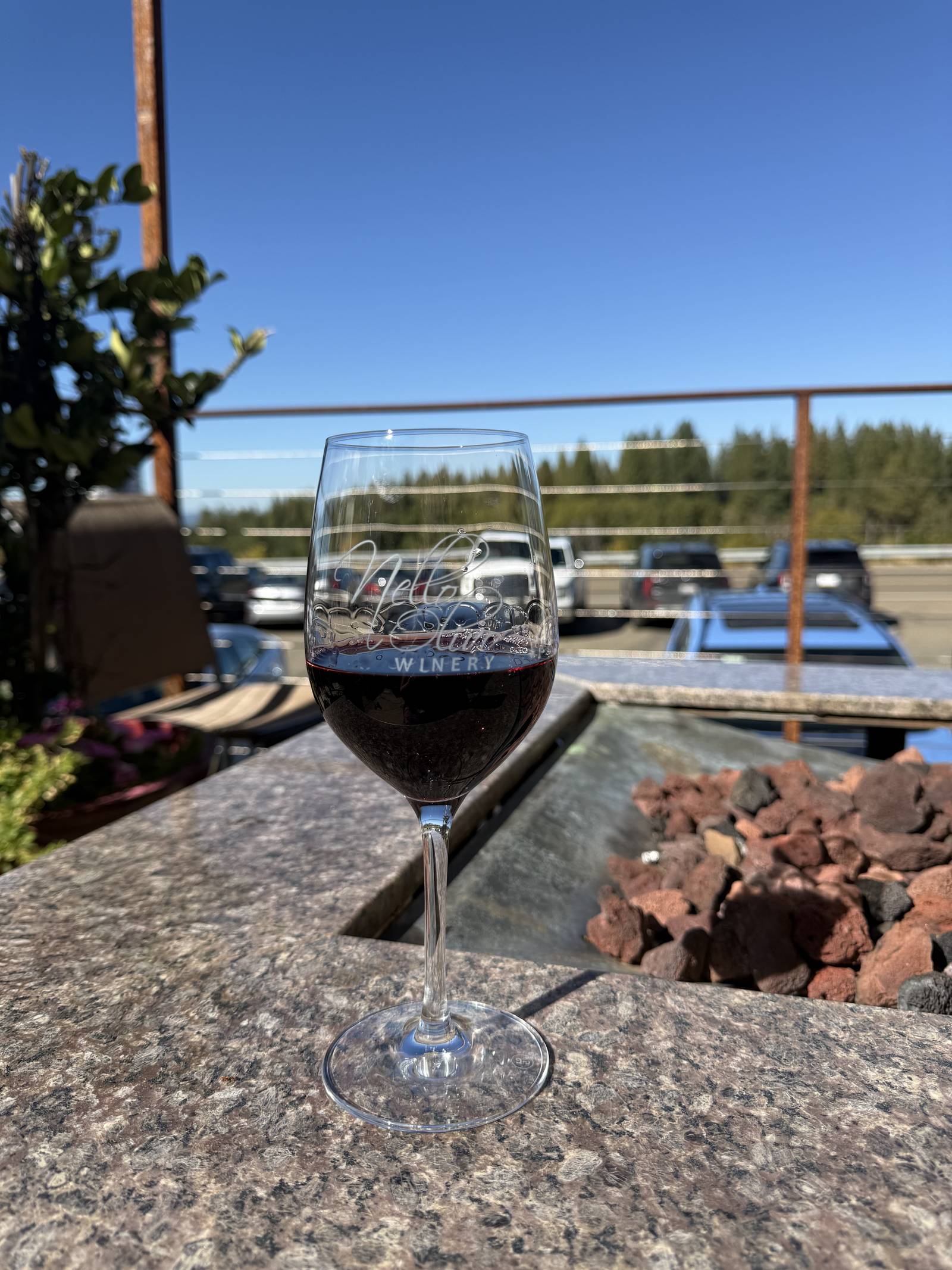 A glass of red at sunset on the Camino patio