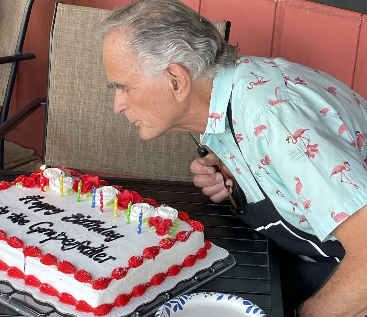 Nello blowing out the candles on his birthday cake