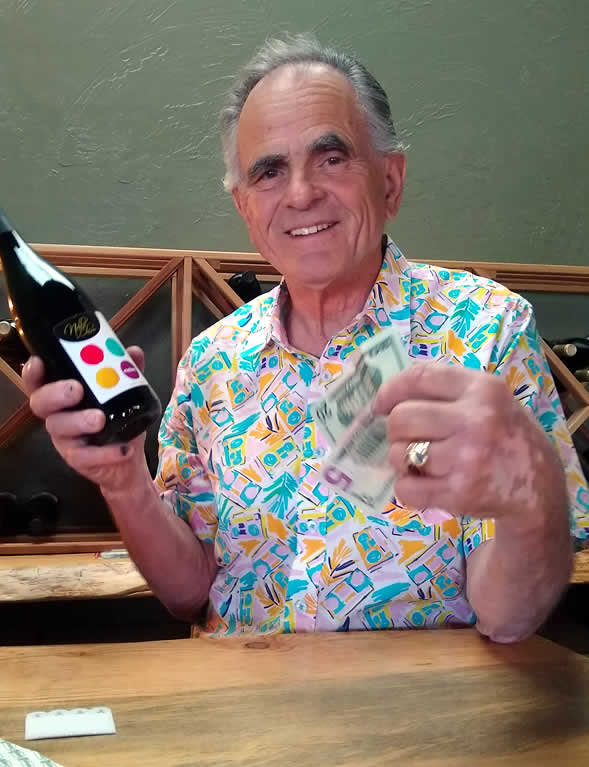 Nello Olivo, aka The Grapefather, makes the first sale of the day at the new Camino tasting room.