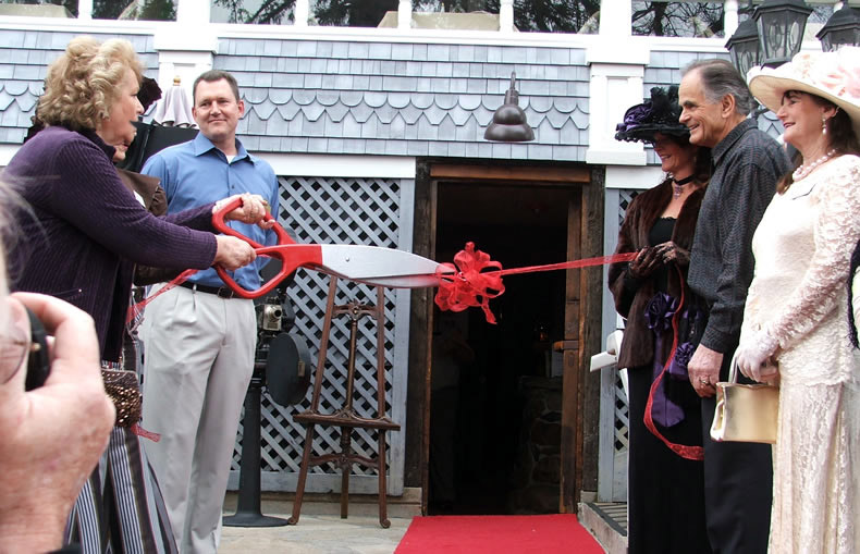 Danica Olivo cuts the ceremonial ribbon to open Nello Olivo Placerville tasting room