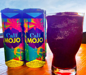 CaliMojo cans, glass filled with slushie.