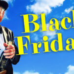 Nello with hat and wine bottle, blue skies and clouds.