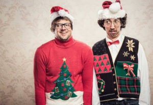 Two men in ugly sweaters.