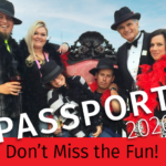 People dressed for fun, boas, hats, wine glasses