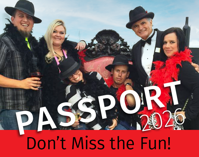 People dressed for fun, boas, hats, wine glasses